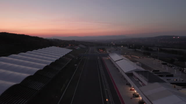 Aerial view of Hungaroring race track, main straight and pit boxes, after sunset