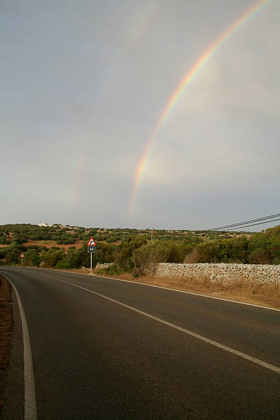 Rainbow in the highway stock photo