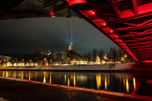 Vilnius, Lithuania - January 26, 2022: Vilnius main symbol, Gediminas castle illuminated for 699th city birthday celebrations during Vilnius Festival of Light.