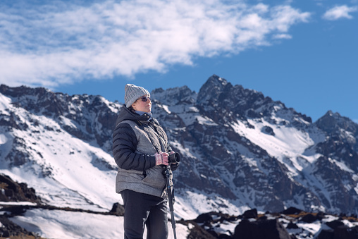 WOMAN IN THE MOUNTAIN. BRIDGE OF THE INCA. MENDOZA. ARGENTINA. HORIZONTAL PHOTOGRAGHY. COLOR.