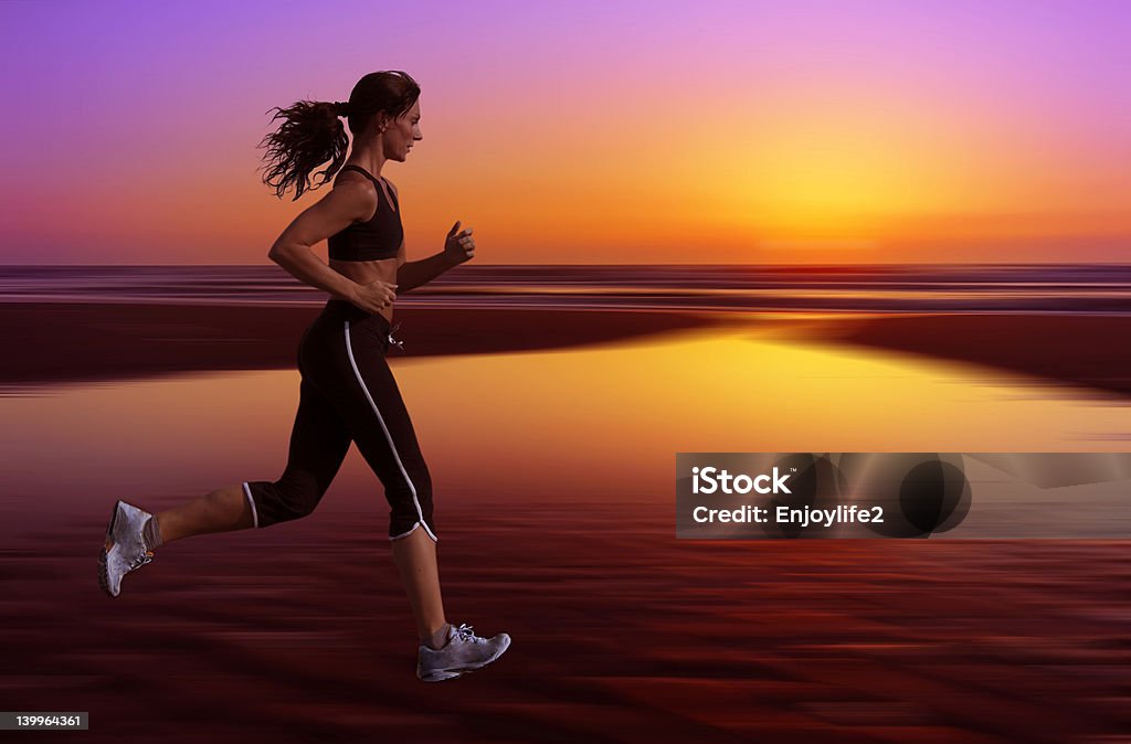 running and sunset woman running during sunset Active Lifestyle Stock Photo