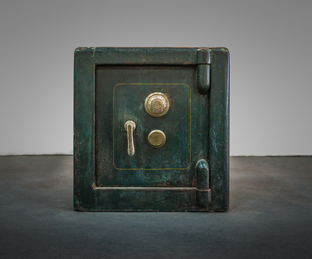 Padlock on an old metal door