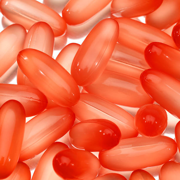 vermelho brilhante gel comprimido - gel capsules - fotografias e filmes do acervo