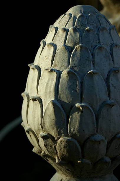 Architectual stone finial, cone or pineapple stock photo