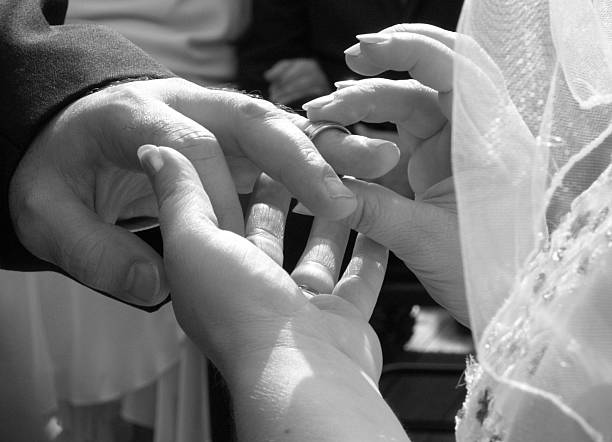 istock Placing Wedding Band on Finger/Black and White 139964554