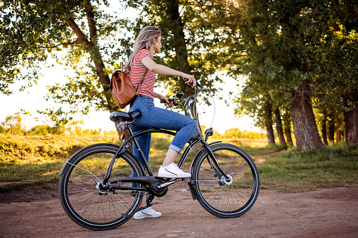 Young woman is riding a bicycle