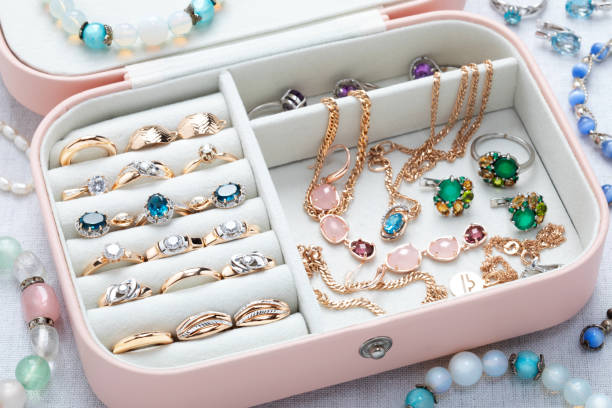 istock Open pink jewelry box with accessories on the table 1399649034