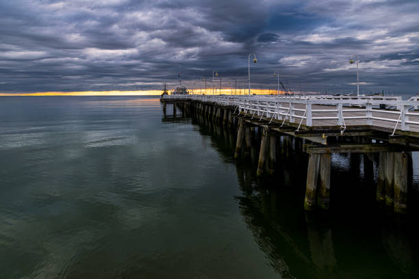 istock Pier on the sea coast and stormy sky 1399650550
