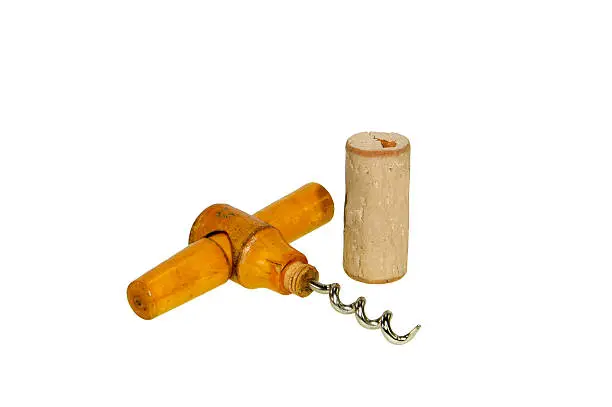 1960s wood handle corkscrew and a cork isolated on white