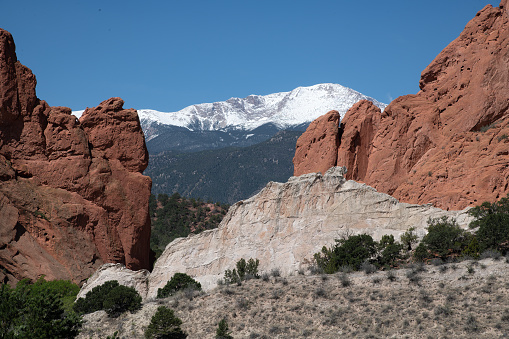 Garden of the Gods central sandstone formations with Pikes Peak background, in free city park donated to Colorado Springs, Colorado, USA in 1909 by Mr. Perkins.