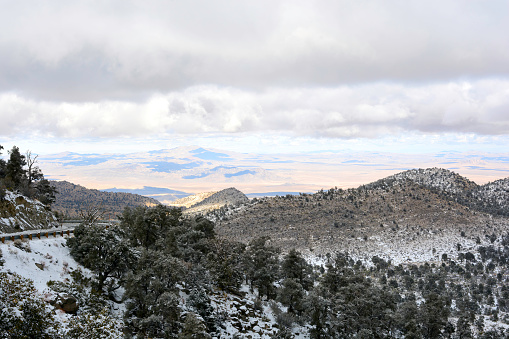Looking out over the vast Mojave desert from the snow filled mountains of Big Bear California.