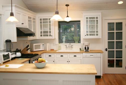 White Country Gourmet Kitchen with Butcherblock Countertops