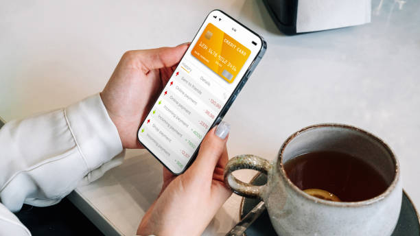 istock Mobile banking network. Smartphone with internet online bank application. Debit card wallet app. Save currency money wallet. 1399657928