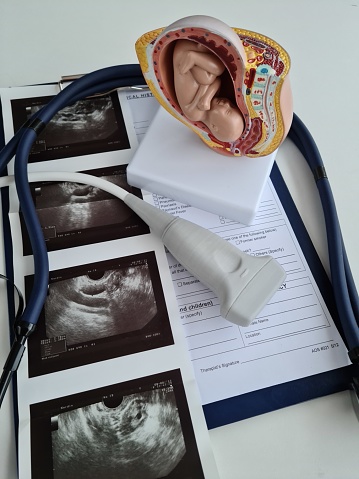 Ultrasound of baby fetus and x-ray scanner. Medical examination of pregnant women concept