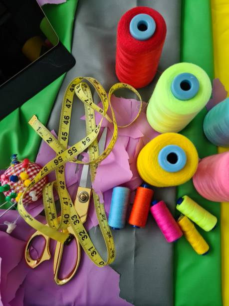 istock Multicolored fabric threads and scissors in atelier closeup 1399666640