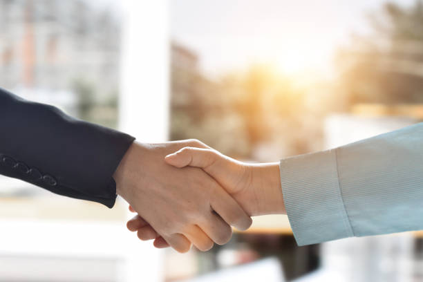 Close-up image of businessman handshake. Business partnership meeting concept. stock photo