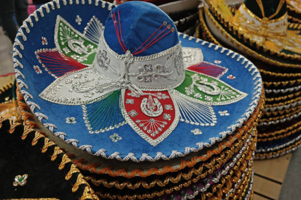 istock Light Blue Sombrero on Stack of Ornate Sombreros 1399678024
