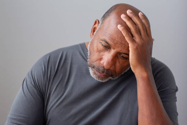 istock Older man not feeling well and having a headache. 1399678211
