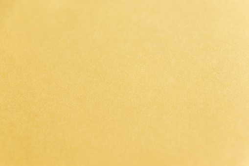 Texture of the surface of cream-colored paper