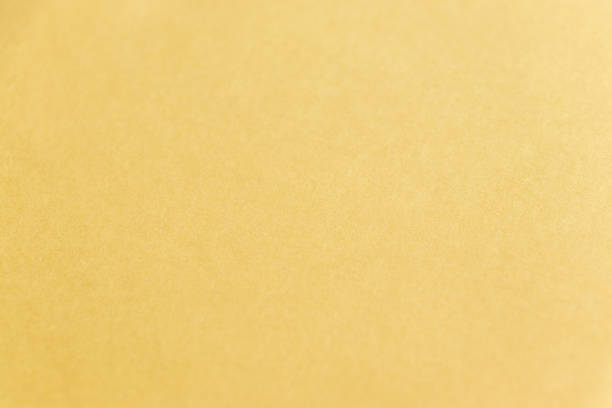 Texture of the surface of cream-colored paper Texture of the surface of cream-colored paper tawny stock pictures, royalty-free photos & images
