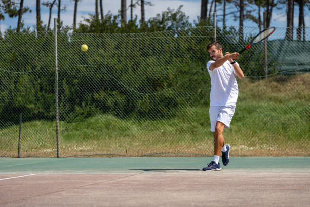 istock Tennis player hitting forehand at ball 1399681297