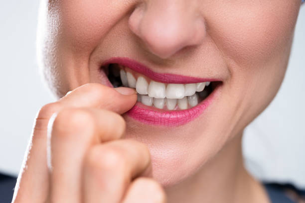 istock Businesswoman Biting Her Fingernail 1399683182