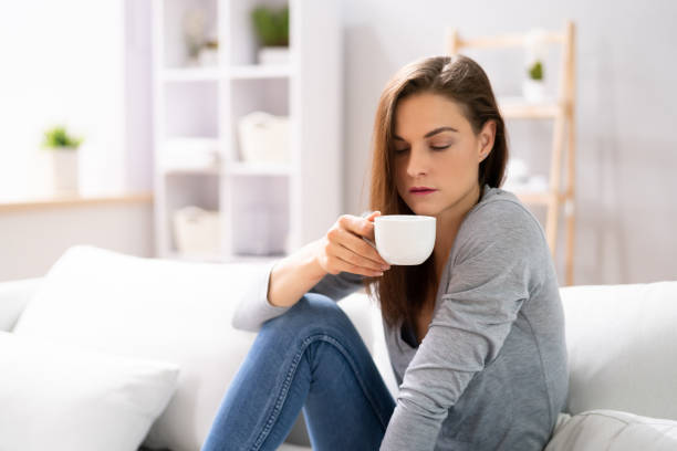 istock Woman Sitting On Sofa At Home 1399683401