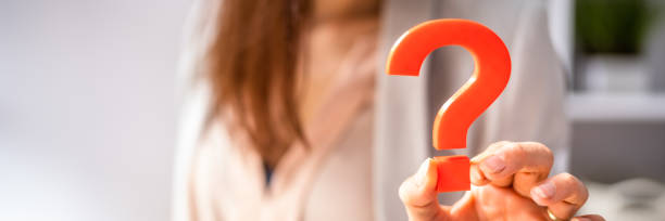 istock Businessperson Holding Question Mark Sign 1399683488