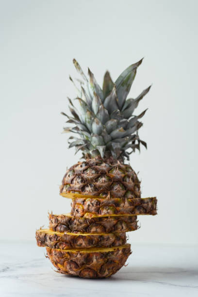 istock ripe pineapple cut into pieces on a white background. Close up. Juicy fruit 1399686897