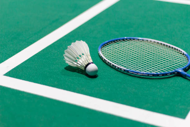 badminton balls and badminton rackets Shuttlecock in green badminton balls and badminton rackets Shuttlecock in green badminton court used in competition shuttlecock stock pictures, royalty-free photos & images