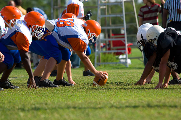 futbol amerykański-młodzież - football child american football team zdjęcia i obrazy z banku zdjęć