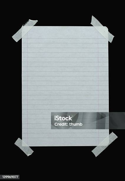 Piece Of Lined Paper Stuck With Tape Stock Photo - Download Image Now - Adhesive Tape, Lined Paper, Black Background