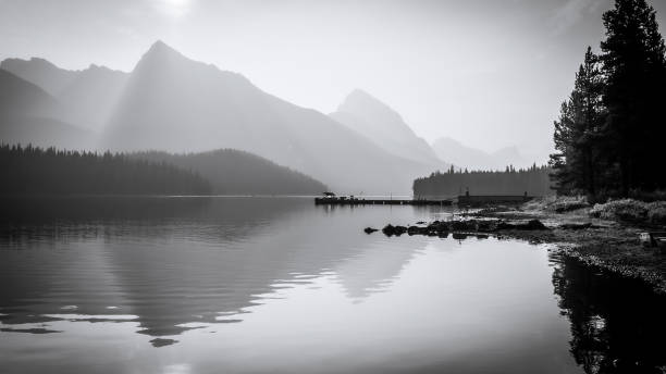 istock Mountains and sun reflecting in still alpine lake, monochromatic, Jasper NP, Canada 1399691563