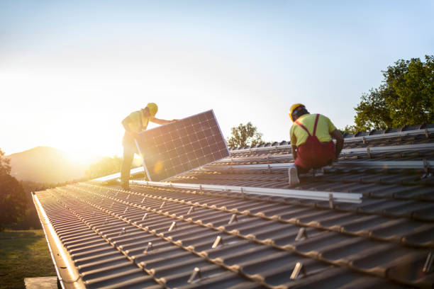 Installation of solar panels on a roof. stock photo