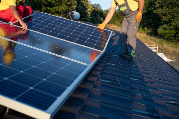 istock Installing solar panels on the rooftop of a house. 1399694329