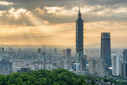 Awesome view of Taipei from top of mountain at sunset, Taiwan. Skyscrapers and other modern buildings of downtown. Amazing cityscape. Taipei is a popular tourist destination of Asia.