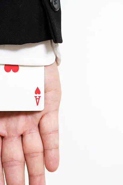 A businessman carrying an ace of hearts