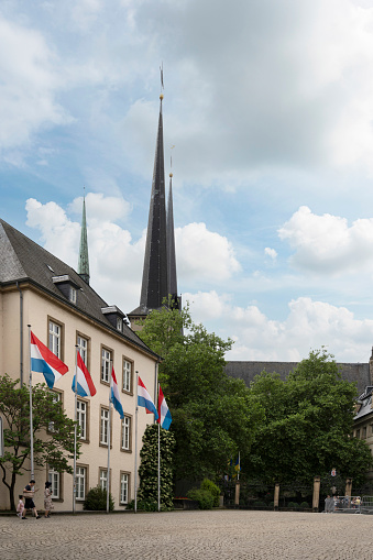 Luxembourg city, May 2022. the flags of Luxembourg flying in a square in the city center