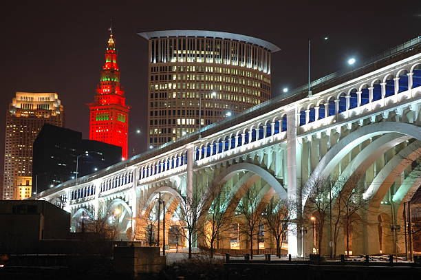 Settlers Landing, Cleveland Ohio Bridge Over Settlers Landing at Night in Cleveland Ohio. terminal tower stock pictures, royalty-free photos & images