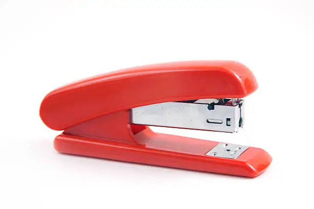 Photo of Red stapler on white background
