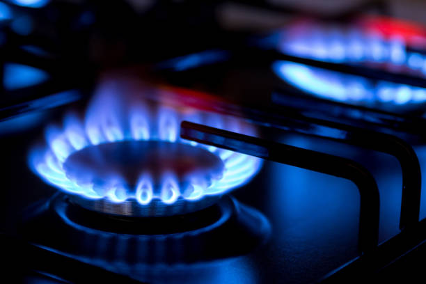 istock Gas burner with blue burnig methane flame on dark background 1399699421
