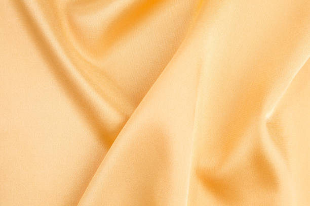 istock Close-up of yellow silk cloth texture. 1399700155