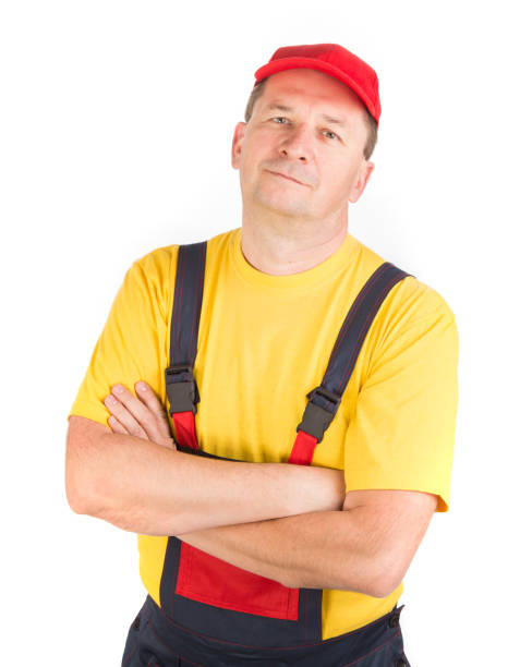 istock A worker in a cap stands with his arms crossed on his chest. 1399700205