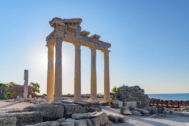 Awesome ruins of the Temple of Apollo in Side, Turkey Awesome ruins of the Temple of Apollo on the Mediterranean Sea coast in Side, Turkey. The Roman temple is a popular tourist attraction in Turkey. Amazing view of columns on sunny day. temple of apollo antalya province stock pictures, royalty-free photos & images