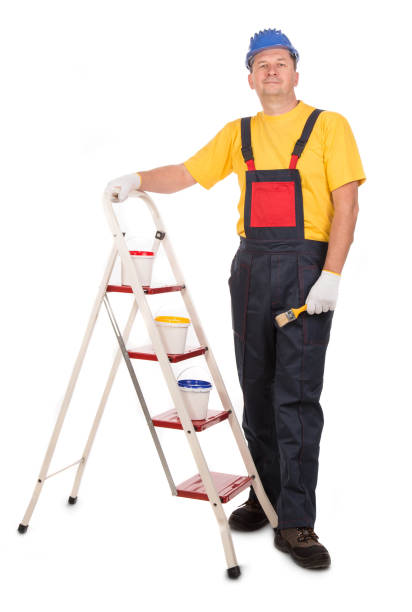 istock A worker on the ladder with a paint brush. 1399700392