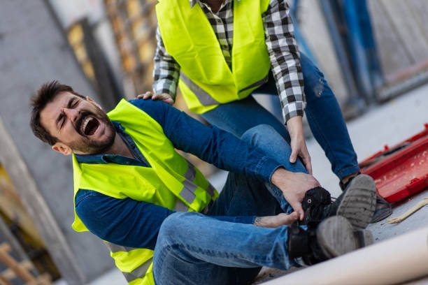 istock Young engineer shouting in pain amid accident on construction site 1399700433