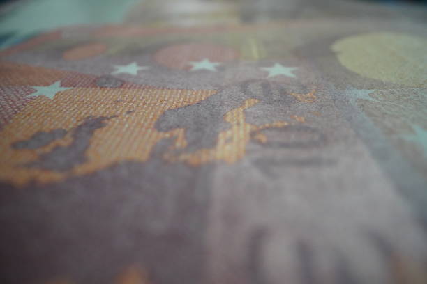 This close-up photos of a ten euros bill, focuses on a detail: the serial number.