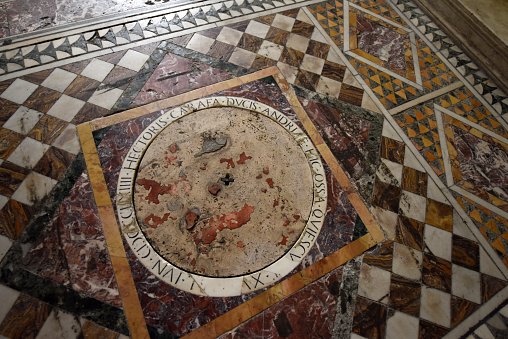 The Naples Cathedral (Duomo di Napoli) is a Roman Catholic cathedral, the main church of Naples. The image shows the flor of the crypta made of different marble stones.
