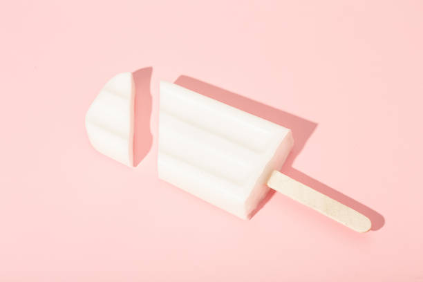 istock Vanilla ice cream on a stick on a pink background. Vector illustration. 1399701636