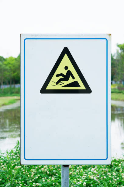 istock A slip warning sign nearby river 1399705380